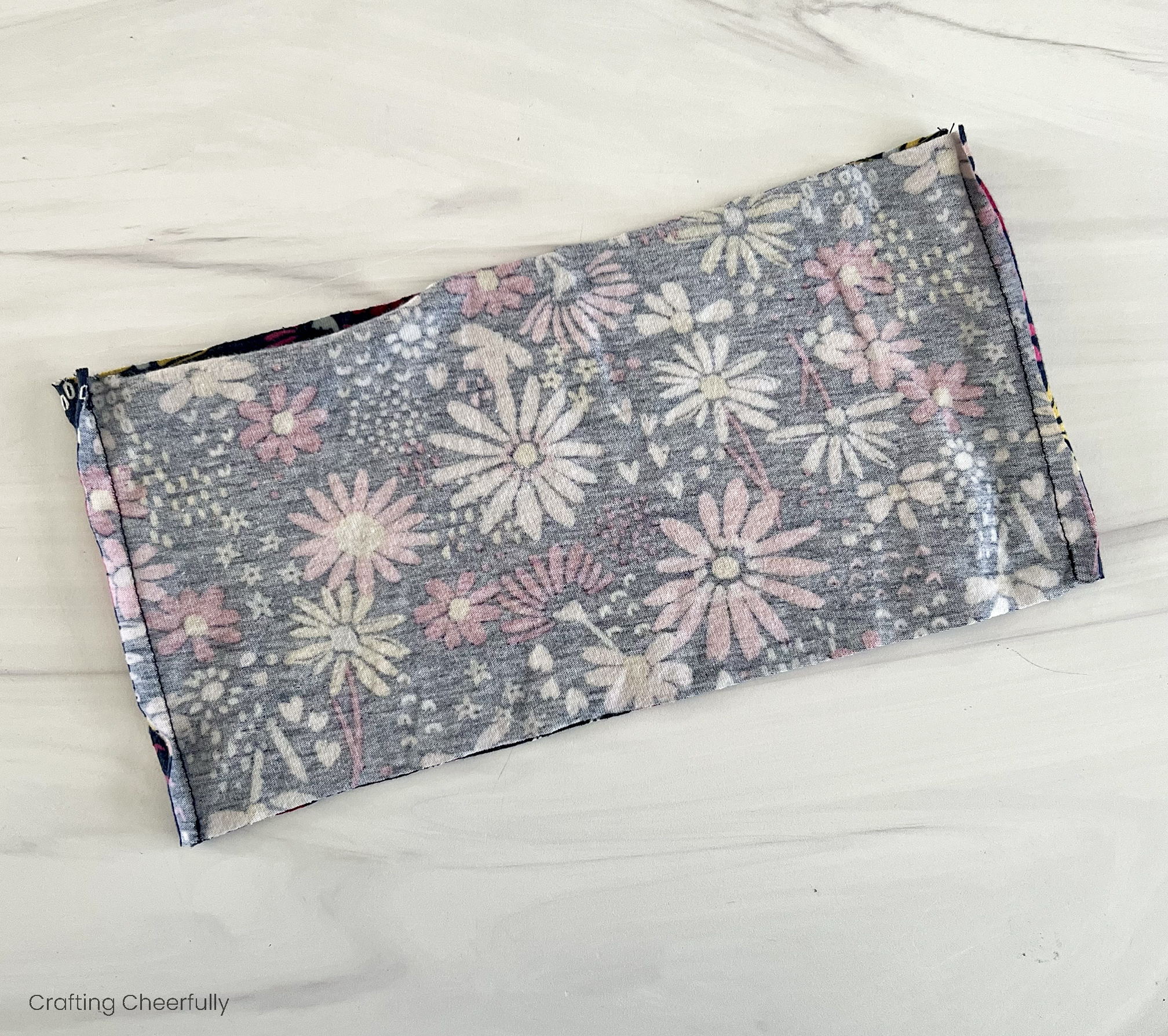 The doll skirt is stitched along both sides to form a tube.