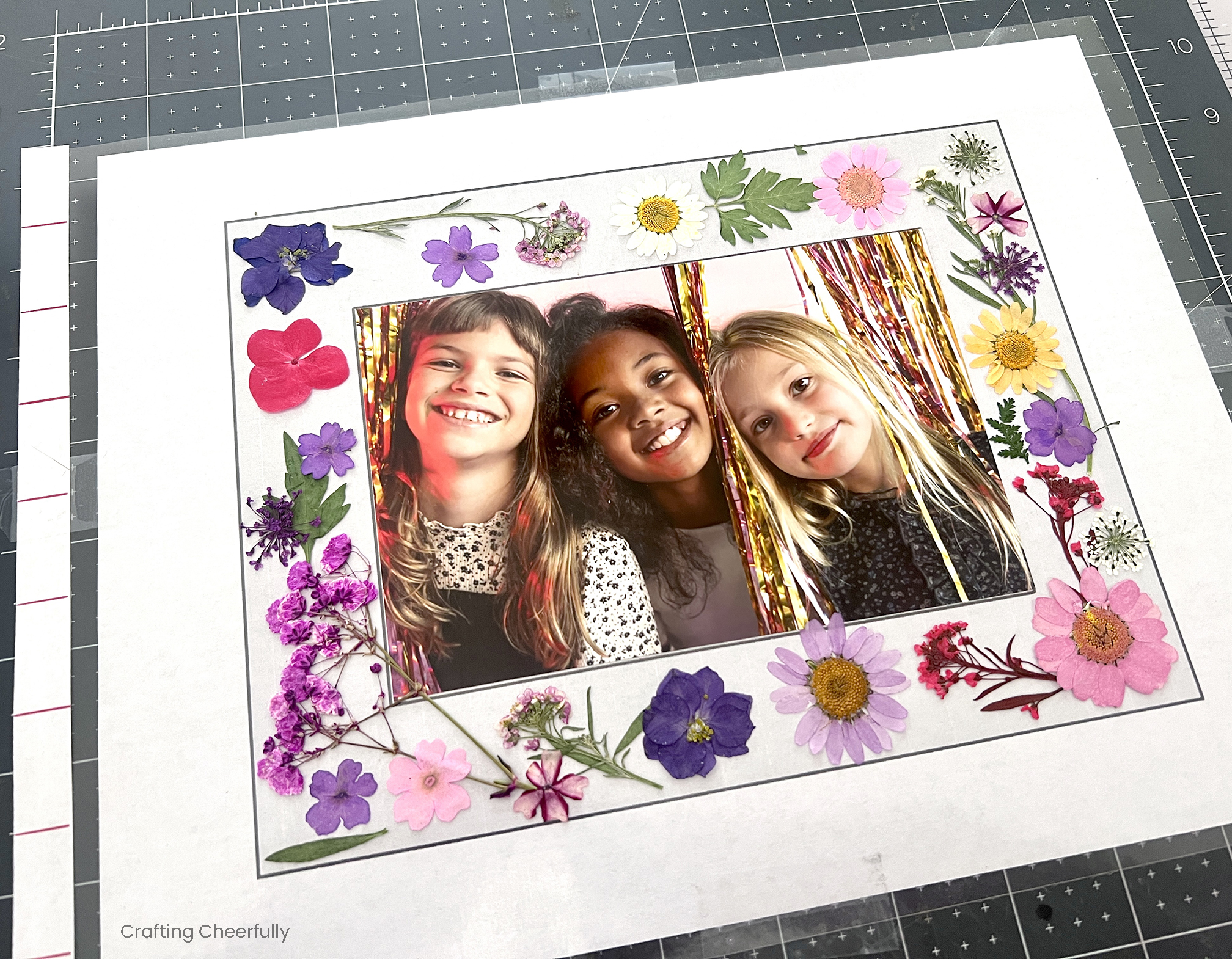 Flowers are arranged on the frame template.
