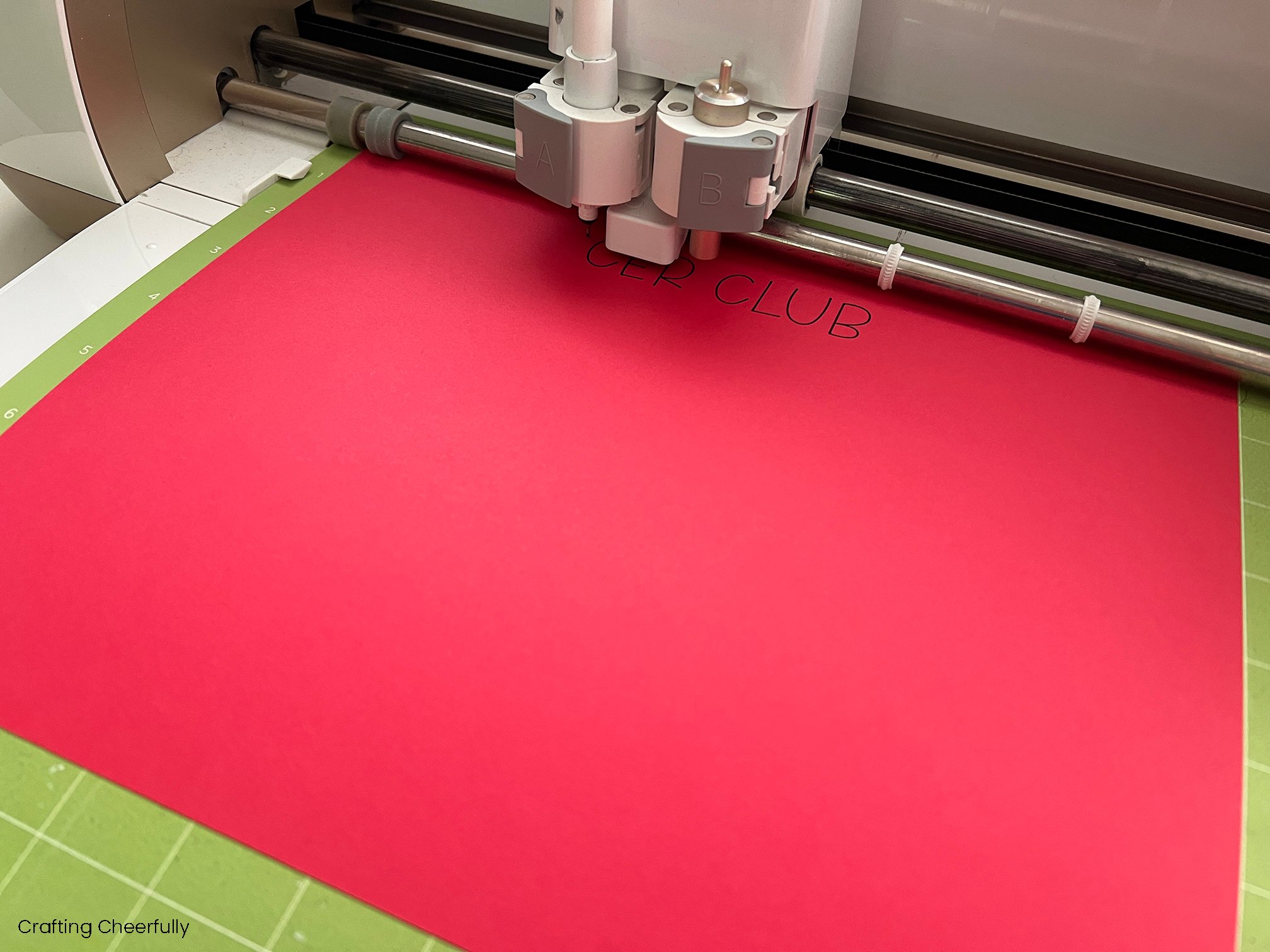 Red cardstock is cut on a Cricut Explore and the text is added with a Cricut Pen.