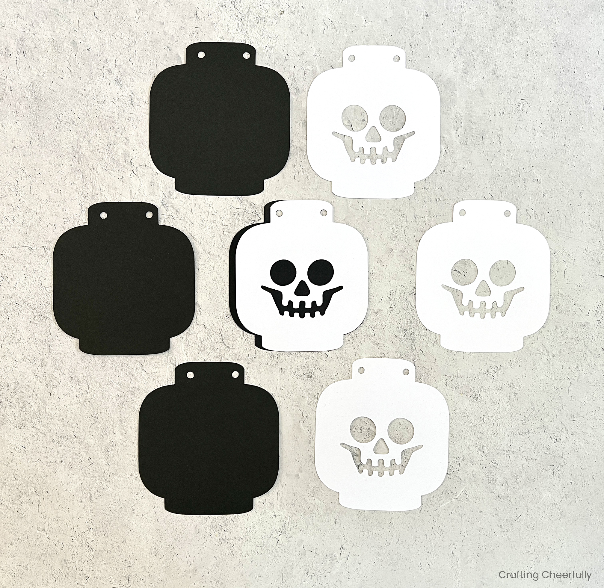 Lego skeleton heads cut from black and white cardstock.
