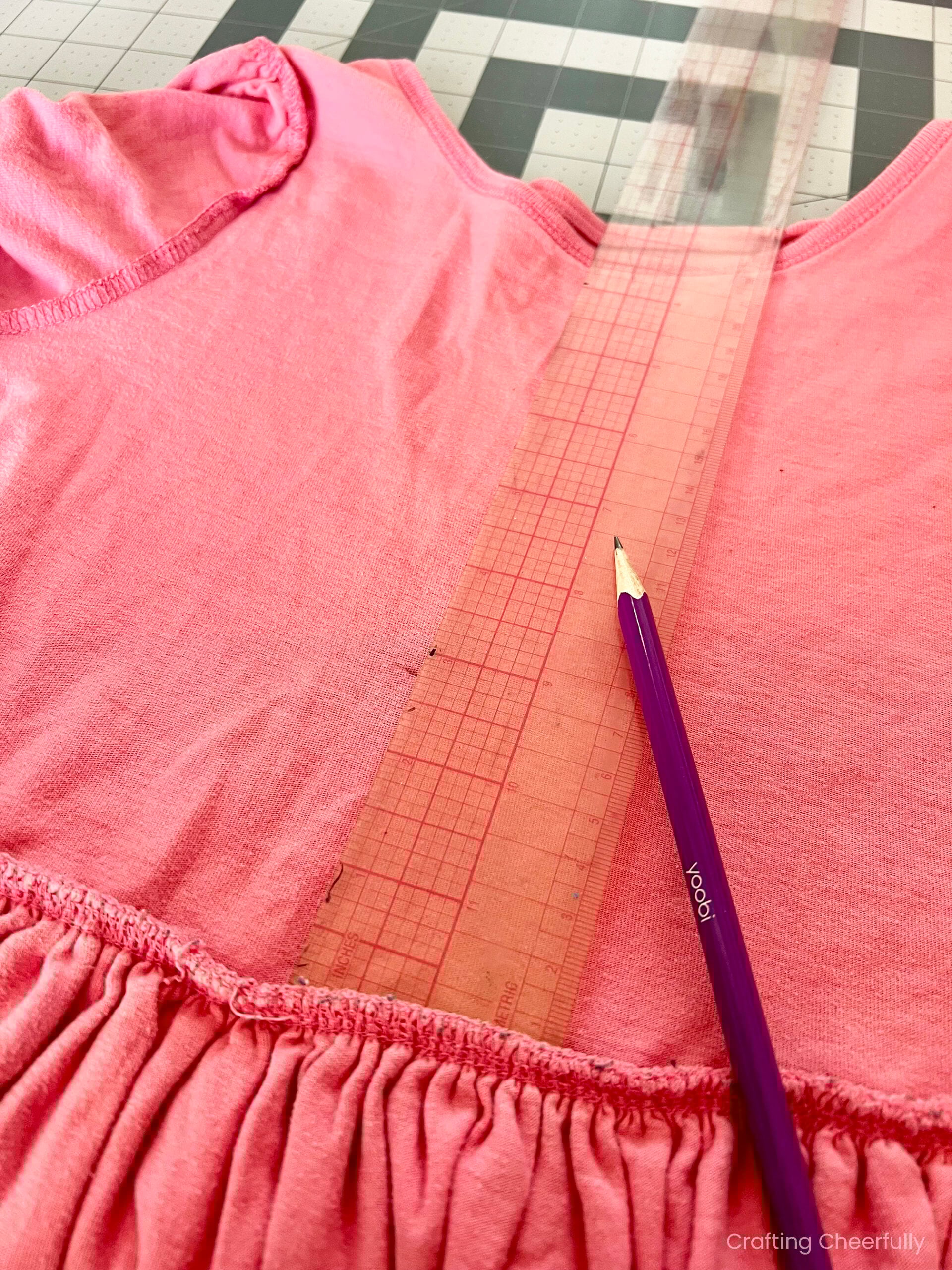 A ruler is used to mark 2.5 inches above the gathered waistline.