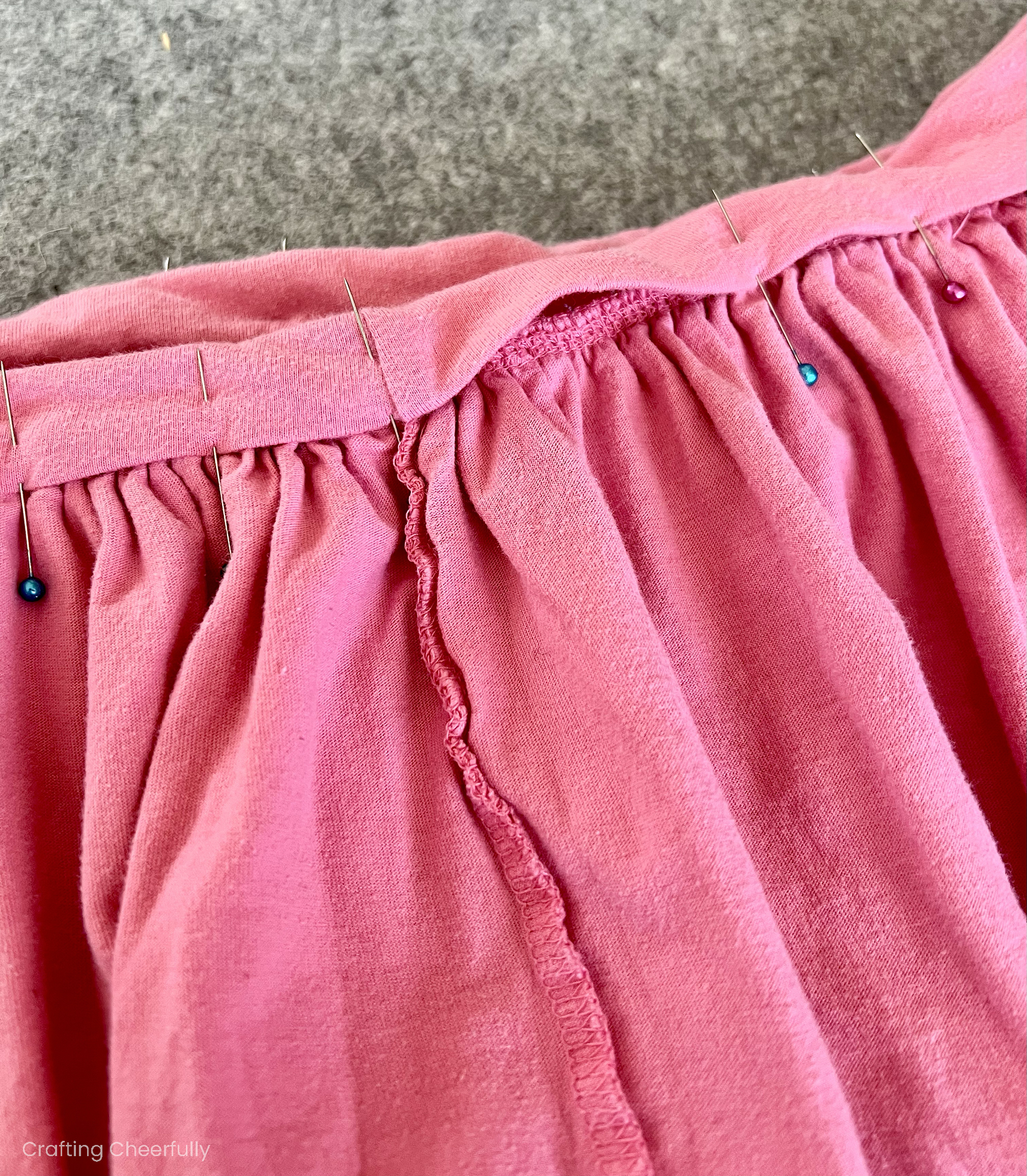 The skirt waistband is pinned with a small gap.