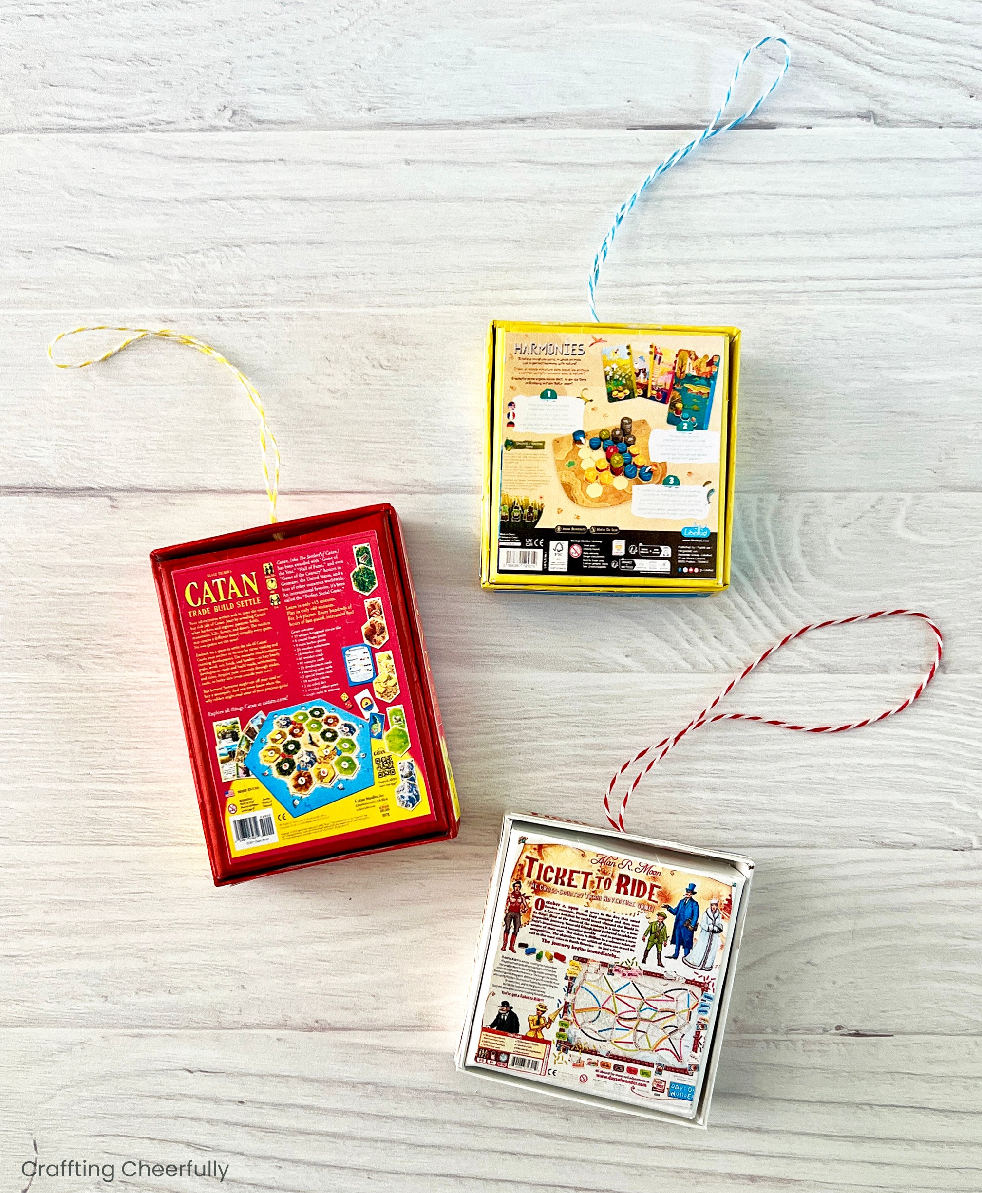 The back of three game board ornaments.