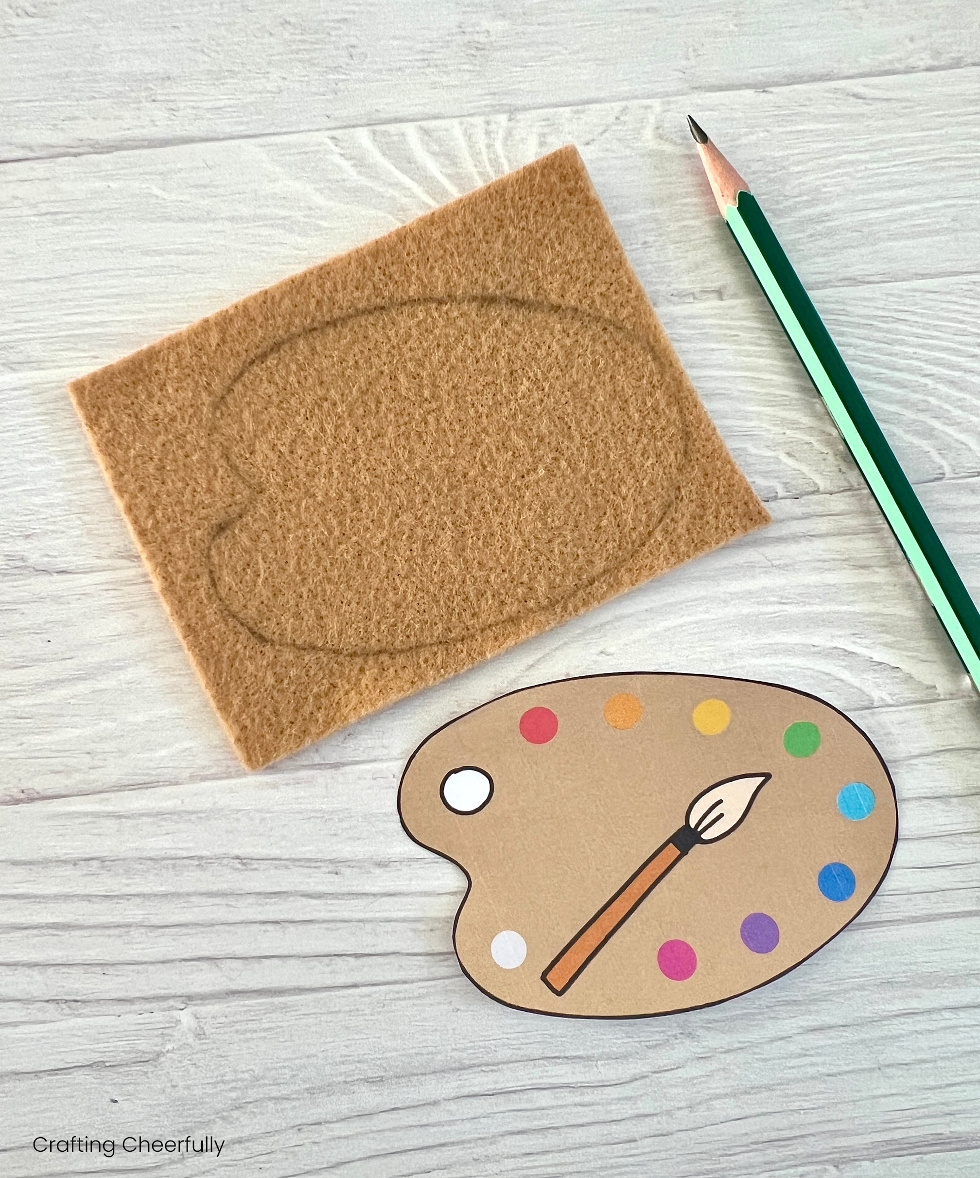 The template is traced onto a piece of tan felt.