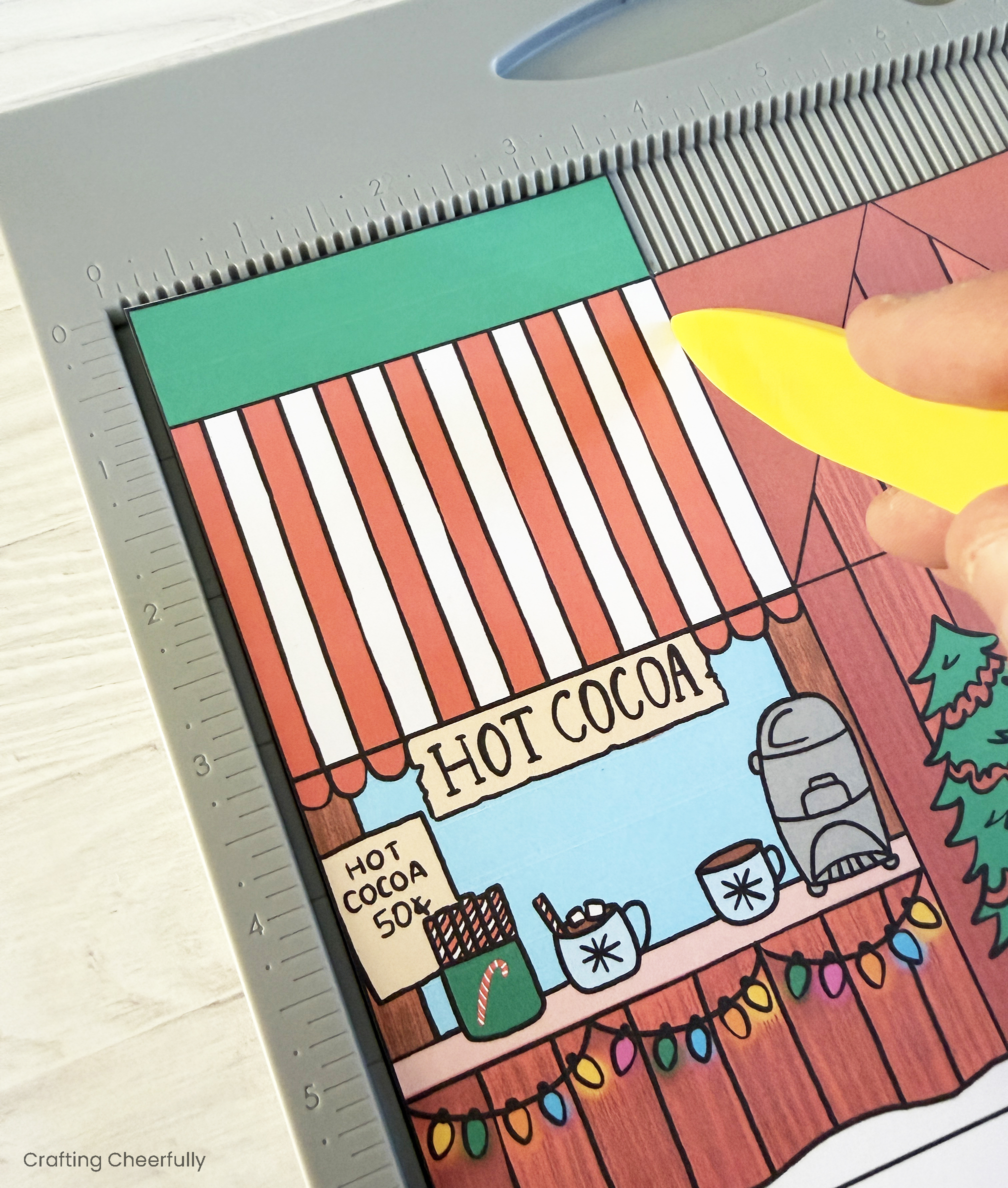 A printable box is scored using a scoring board.