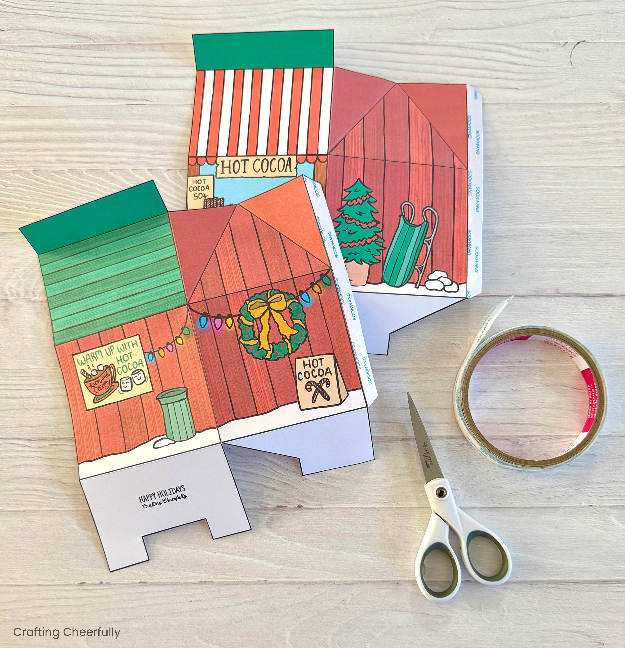 Double-sided tape is added to the tabs on the printable box pieces.