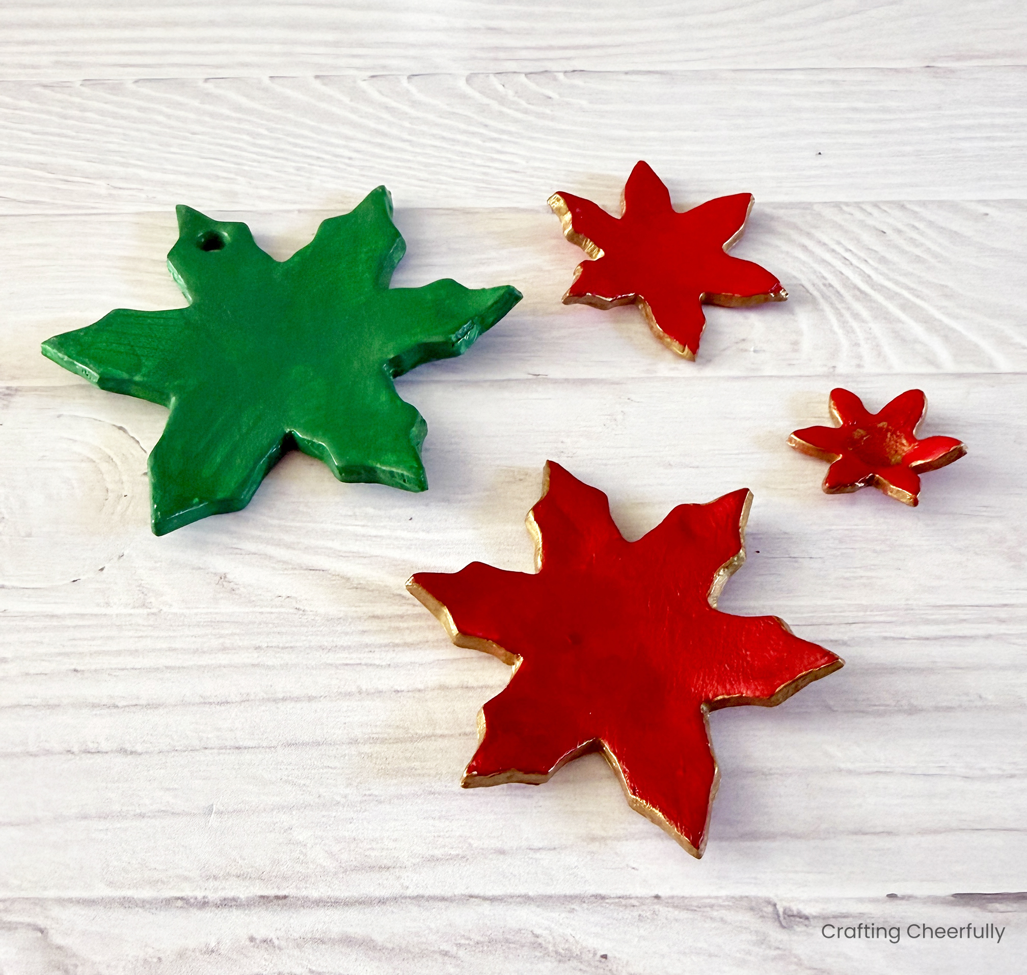 The flower pieces painted red and green with gold edges.