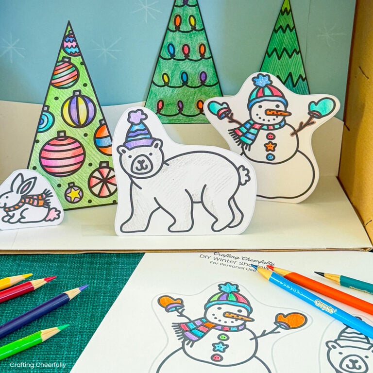 Christmas shadow box made from coloring pages and shoebox.