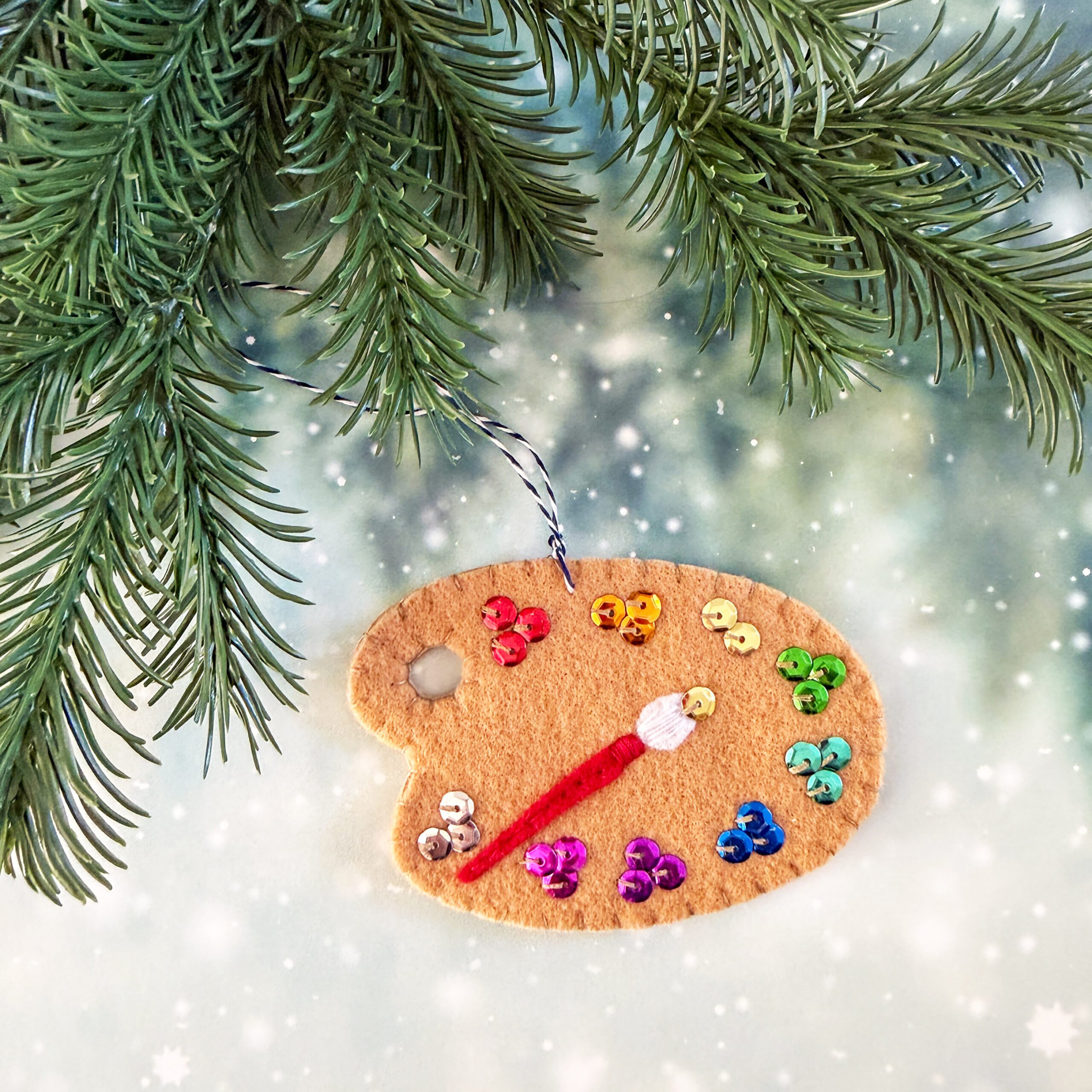 Felt paint palette ornament with sequin paint colors.