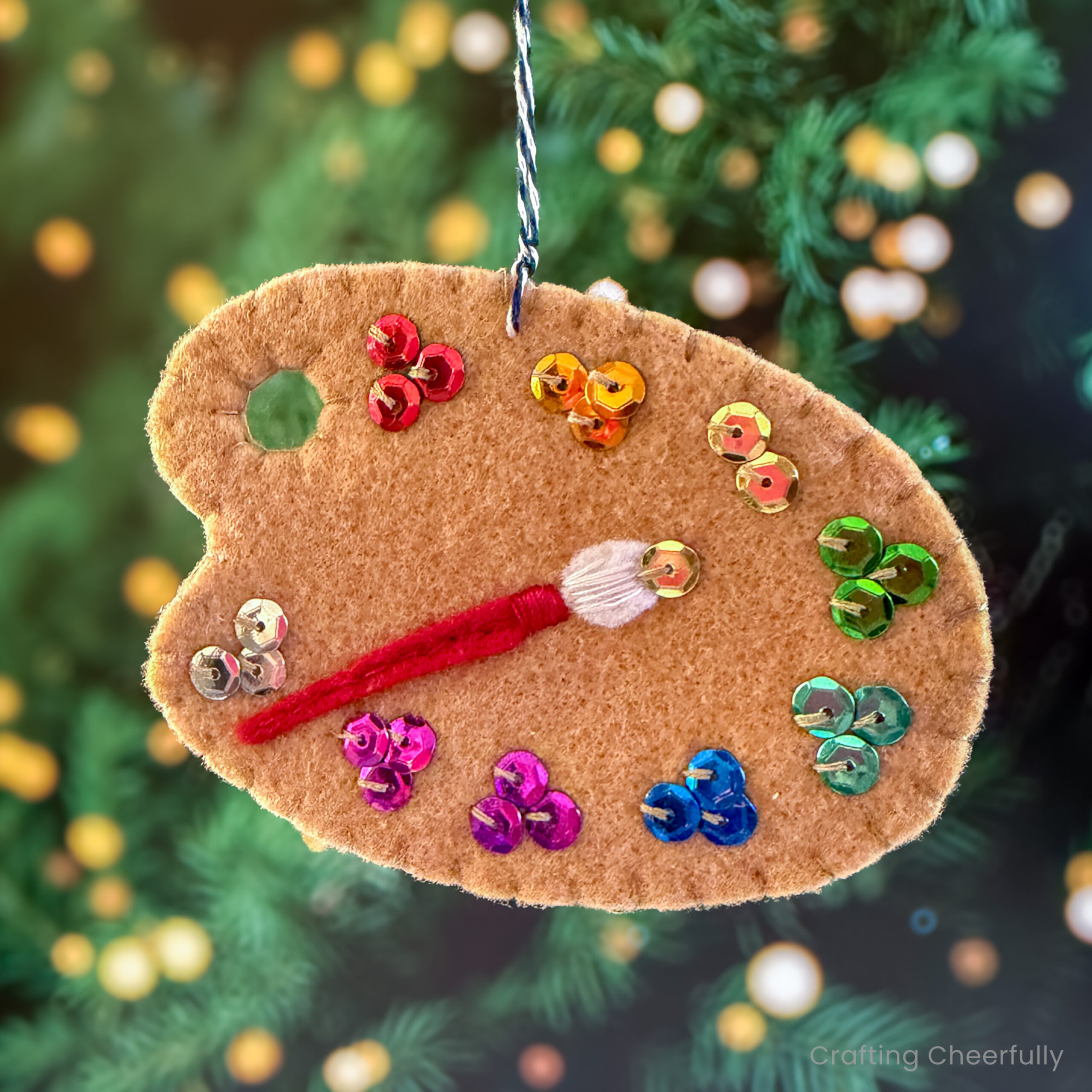 Felt paint palette ornament with sequin paint colors. 