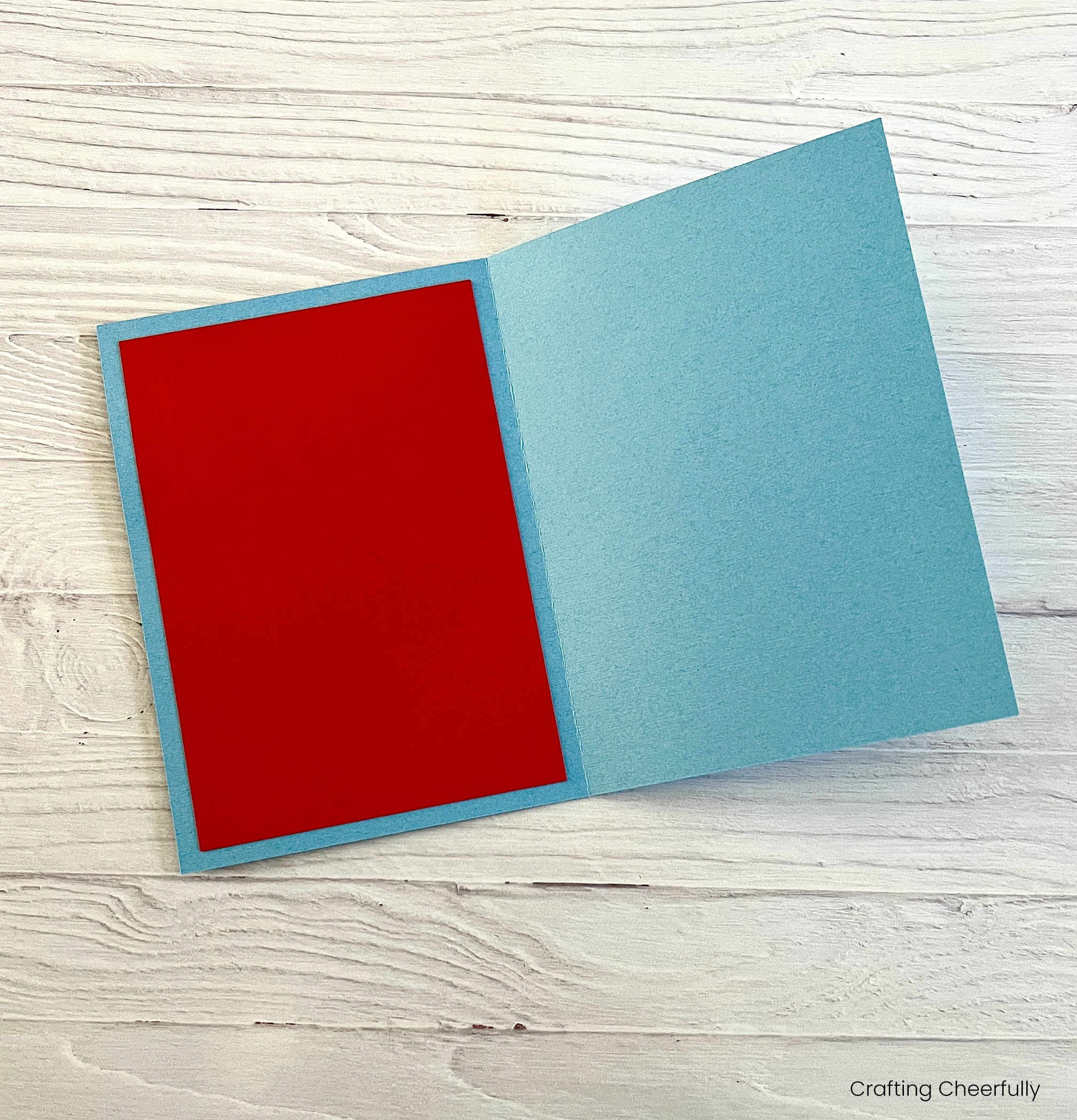 The mailbox card is open and a pice of red cardstock cover the inside cover.