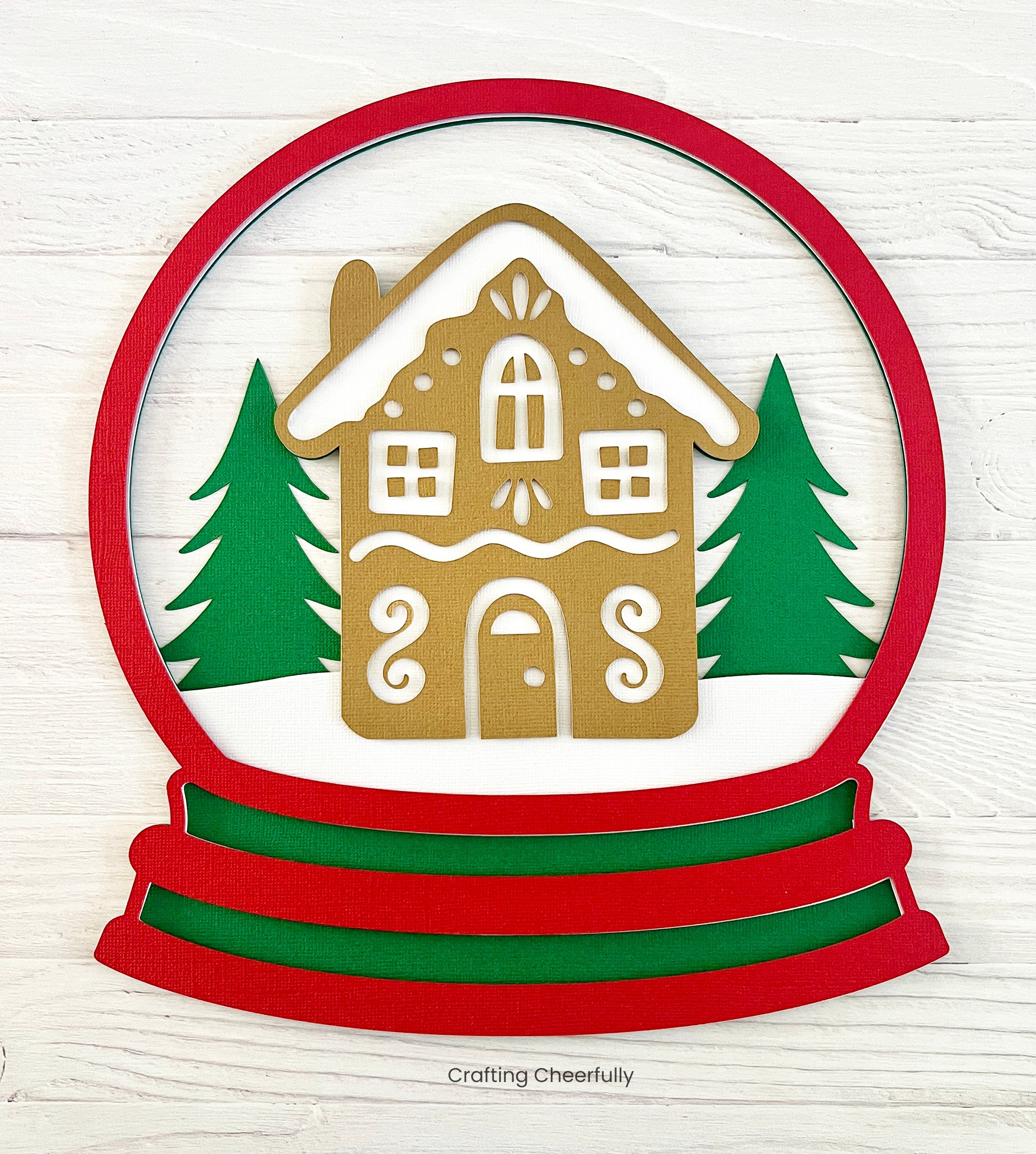 The red and white layers of cardstock are applied to the green cardstock layer.