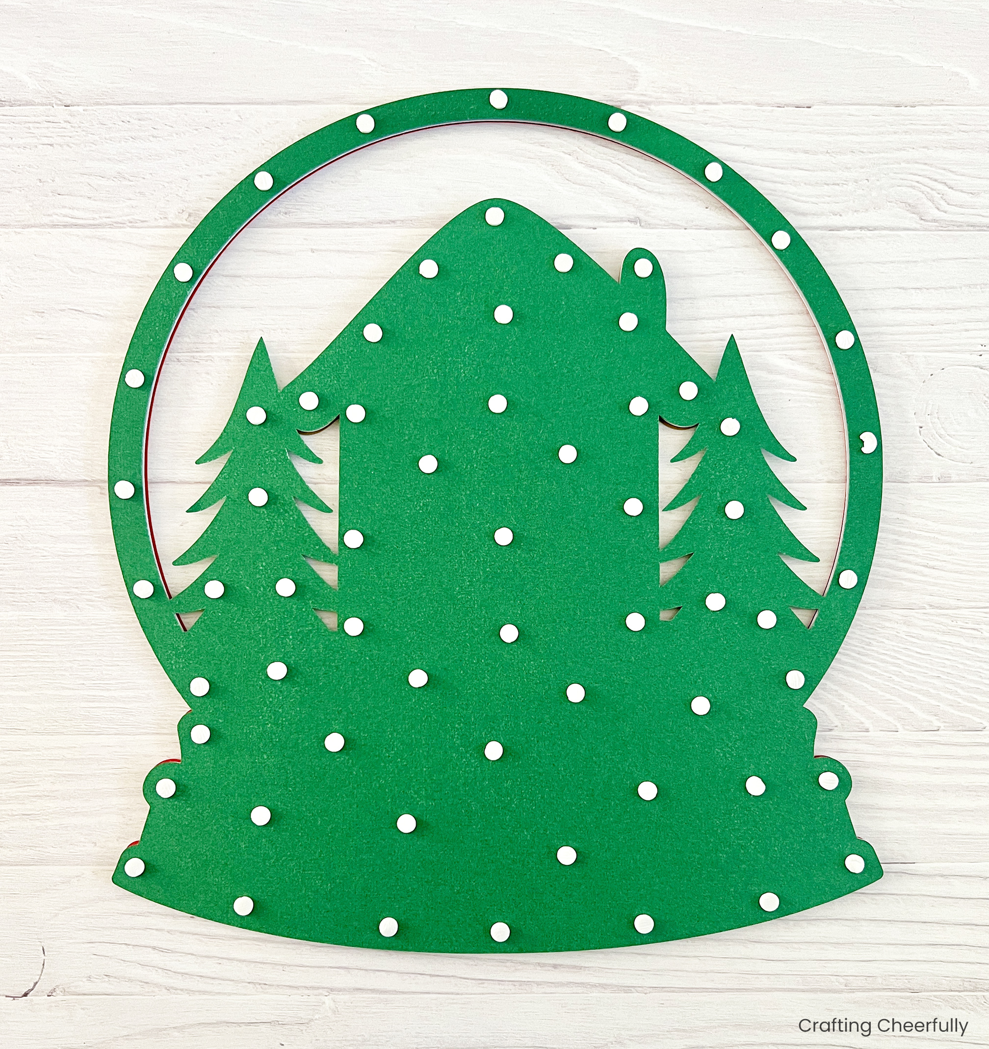 Little foam dots are applied to the back of the green cardstock.