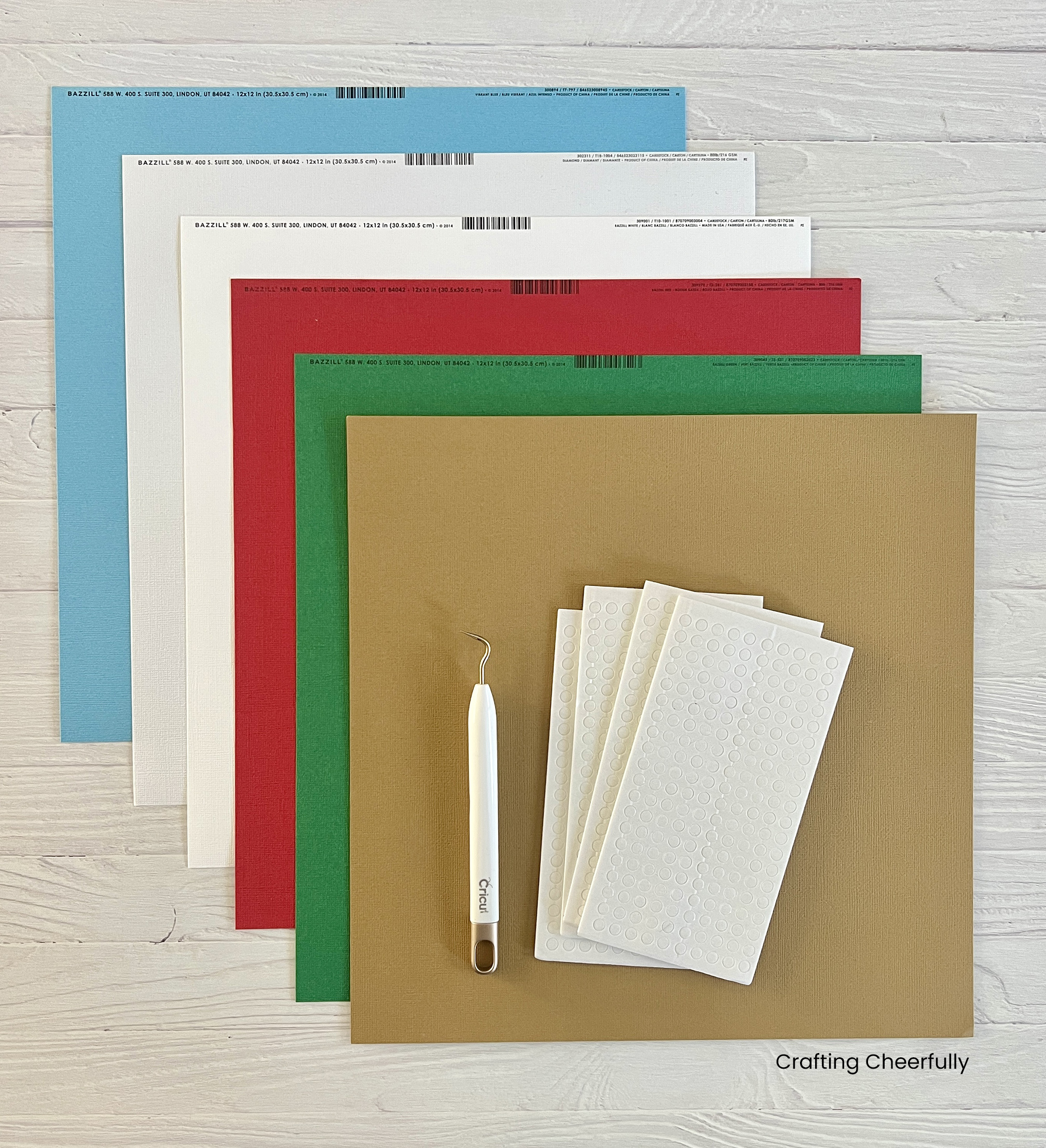 Cardstock in six colors of red, green white, light blue and light brown and foam dots.