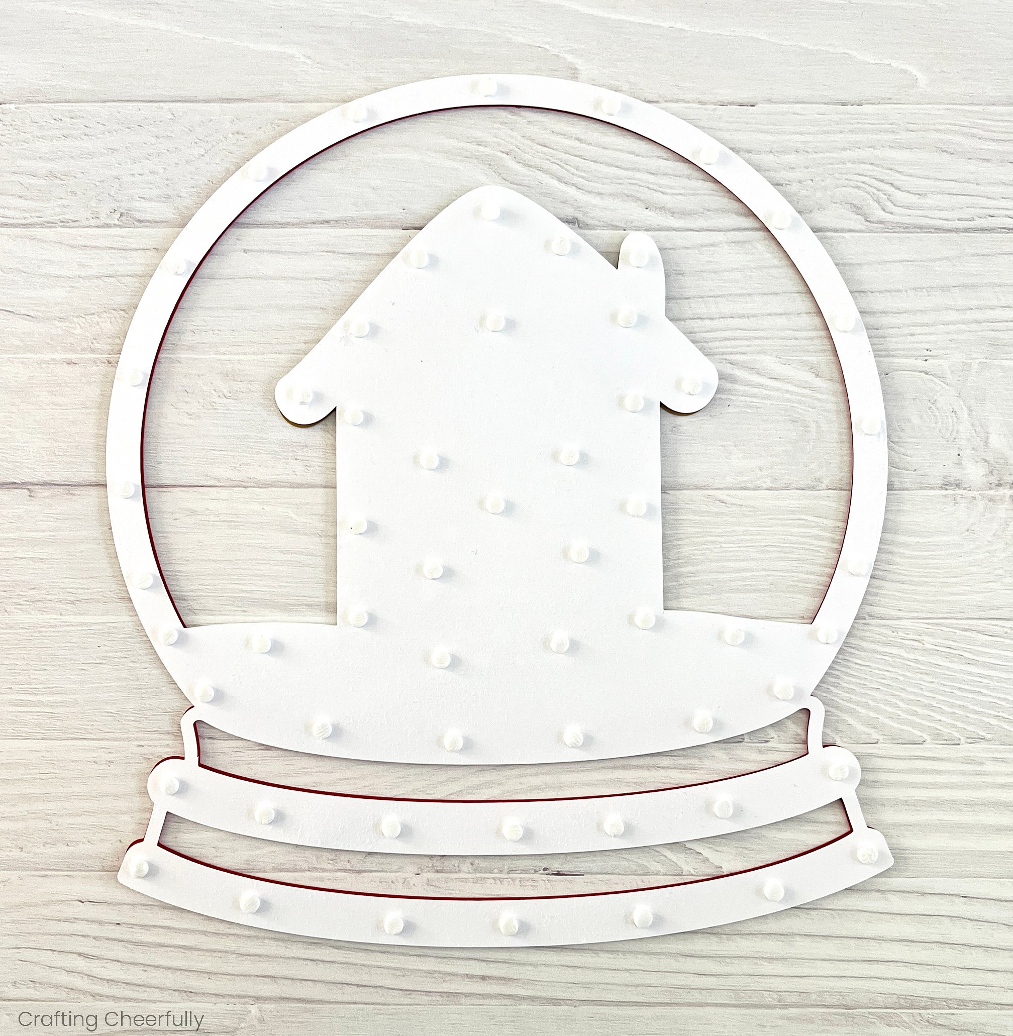 Foam adhesive dots added to the back of the white snow layer.