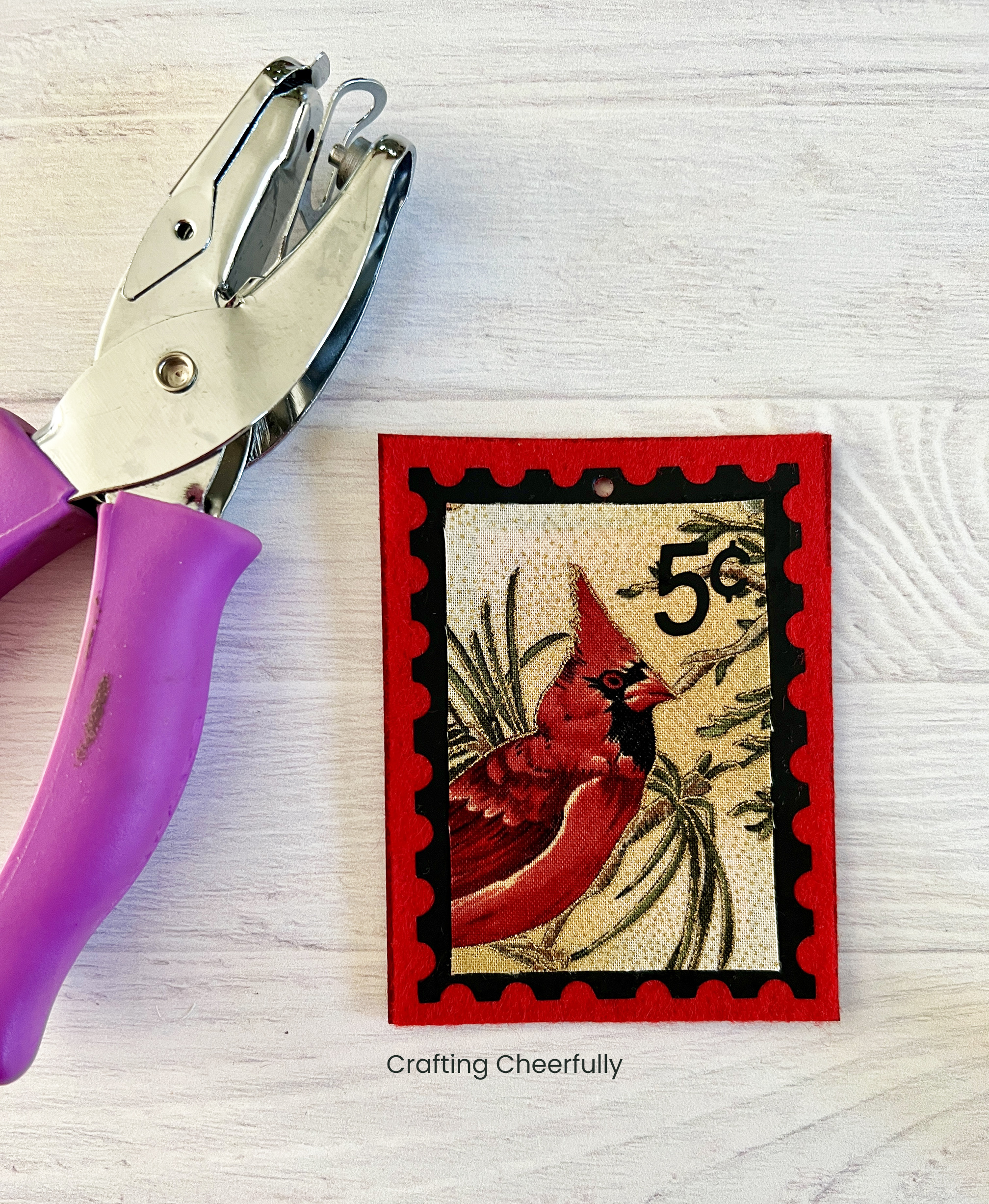 A hole is punched from the top of fabric stamp.