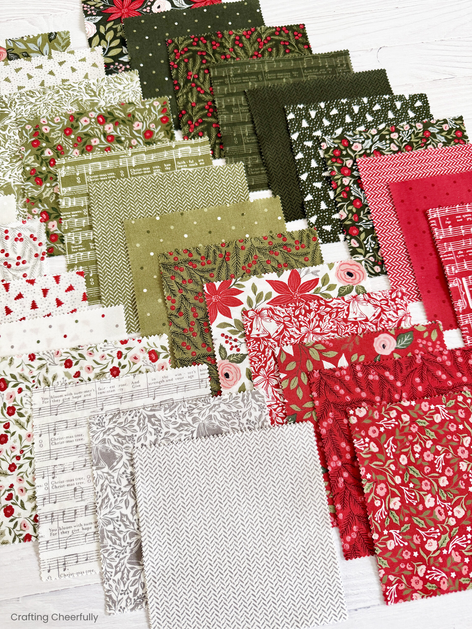 Pieces of fabric from the Berry and Pine charm pack.