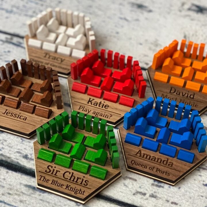 Personalized Catan Piece Holders by Wooden Essense.