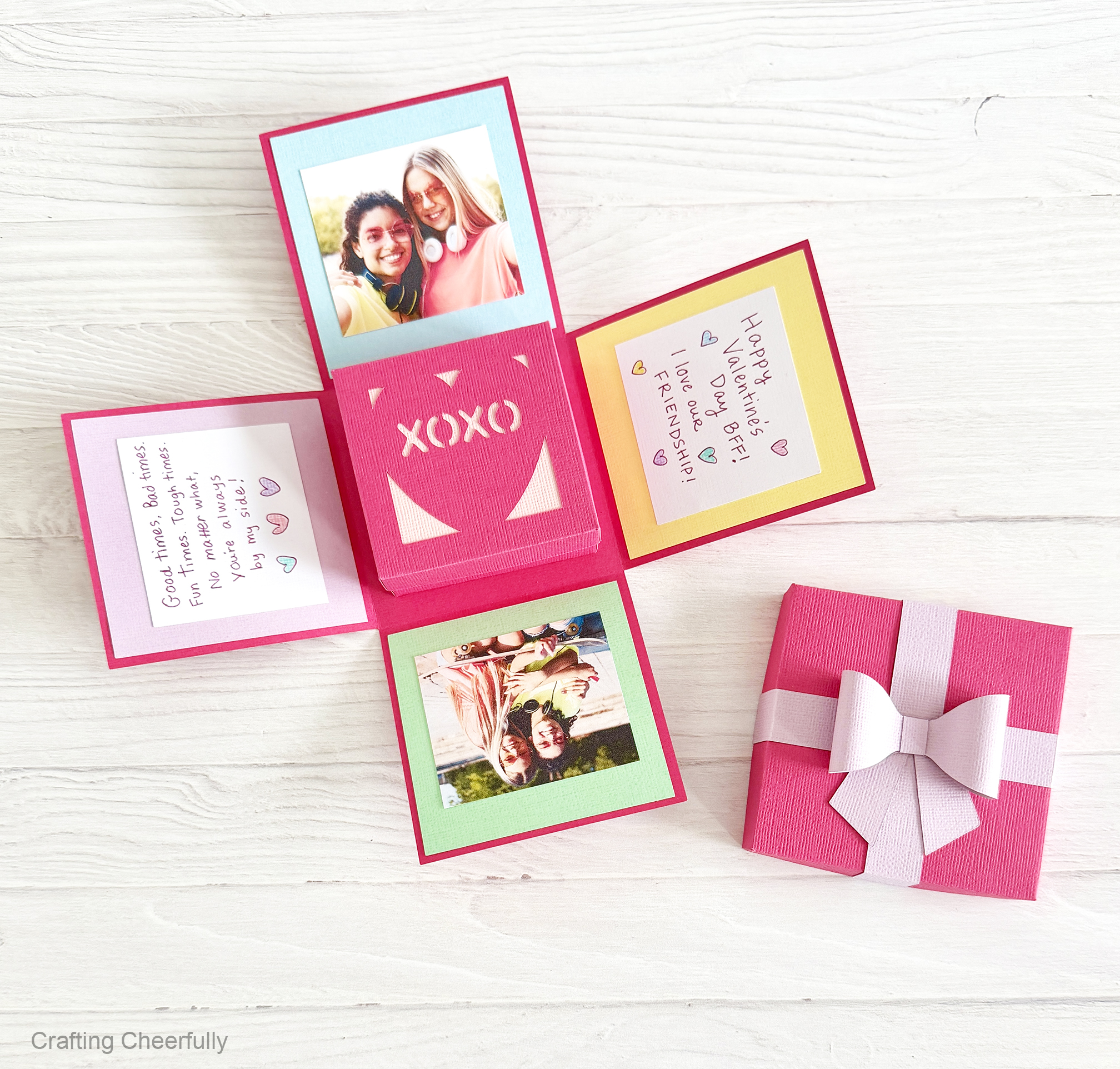 The explosion box lays open showing the fun pictures and notes inside of it. 