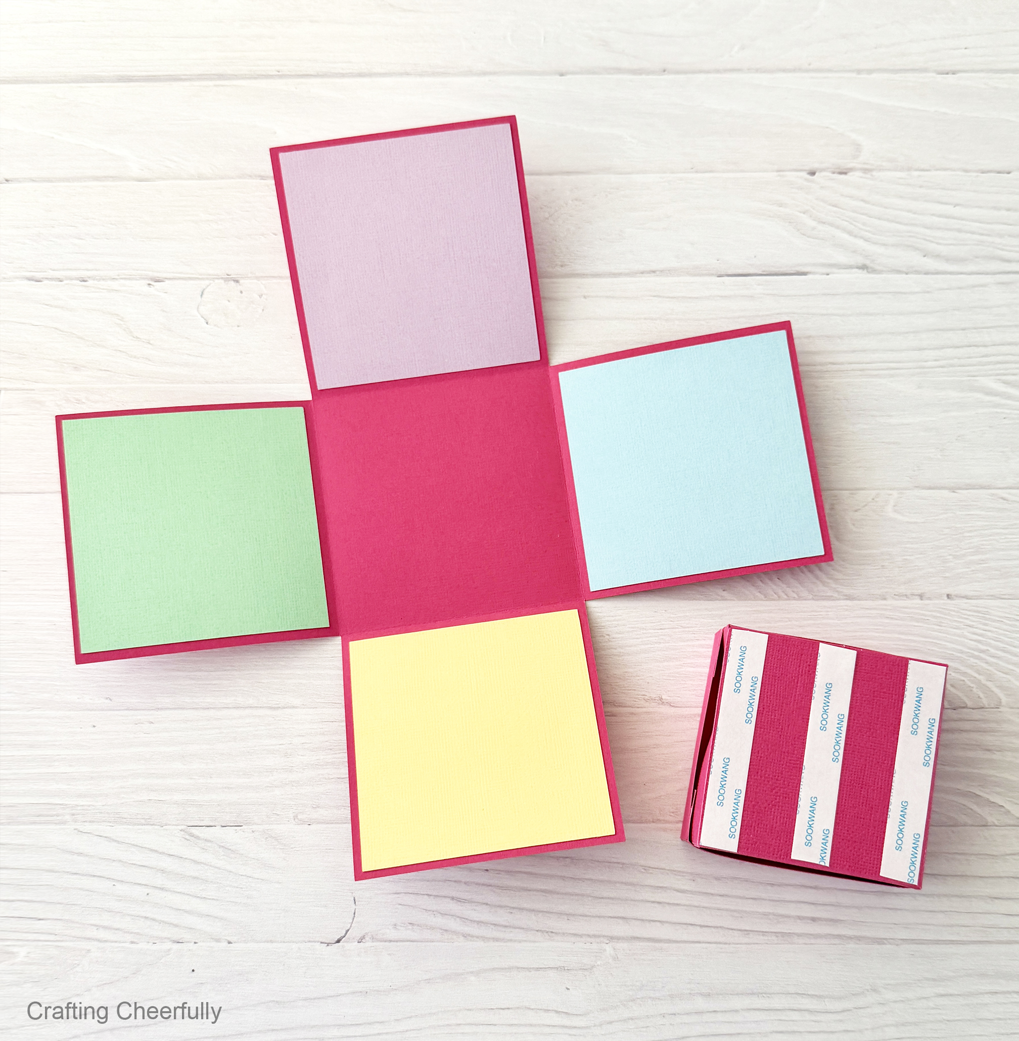 The back of the mini box is covered in strips of double-sided tape.