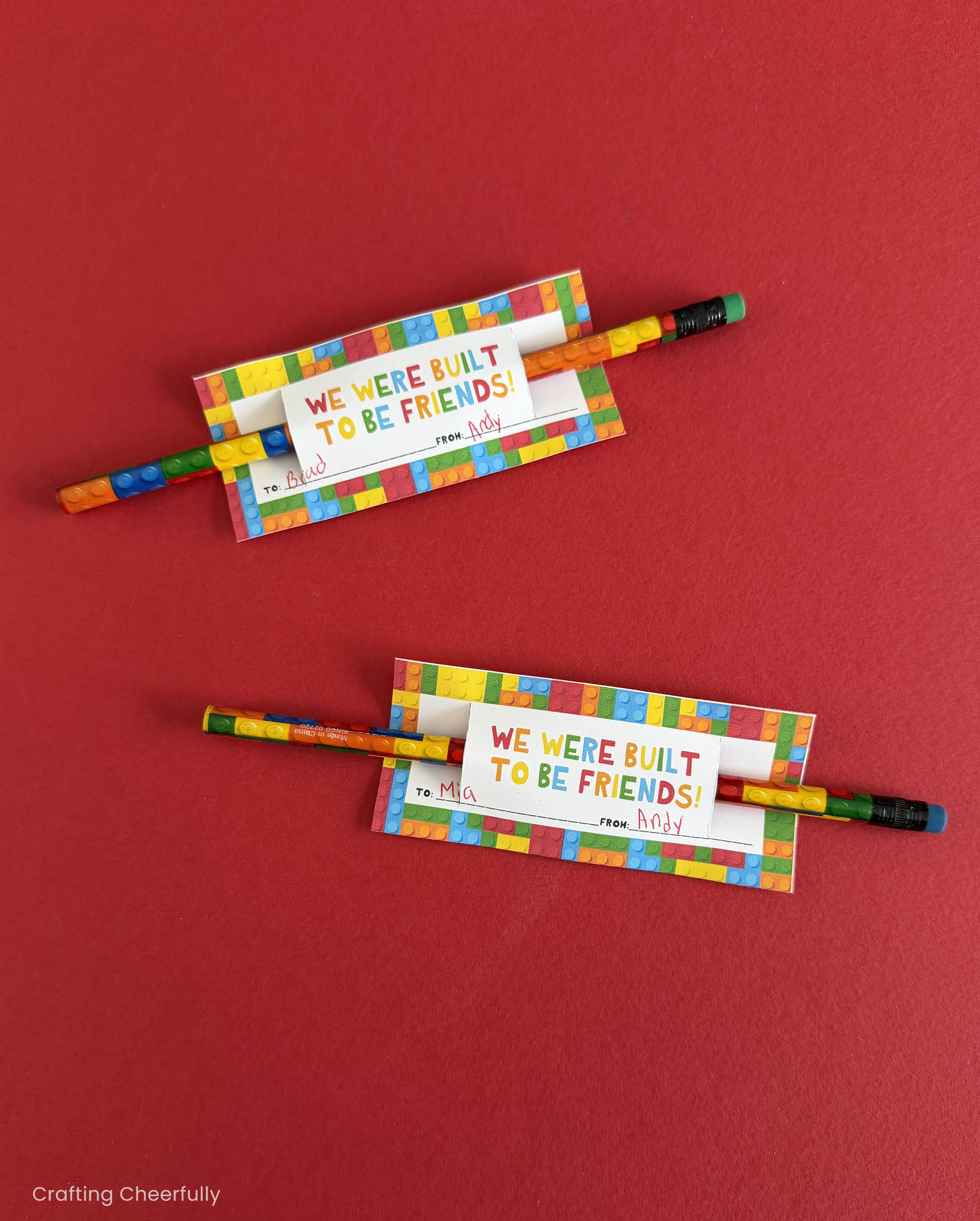 Two lego themed valentines on a red background.