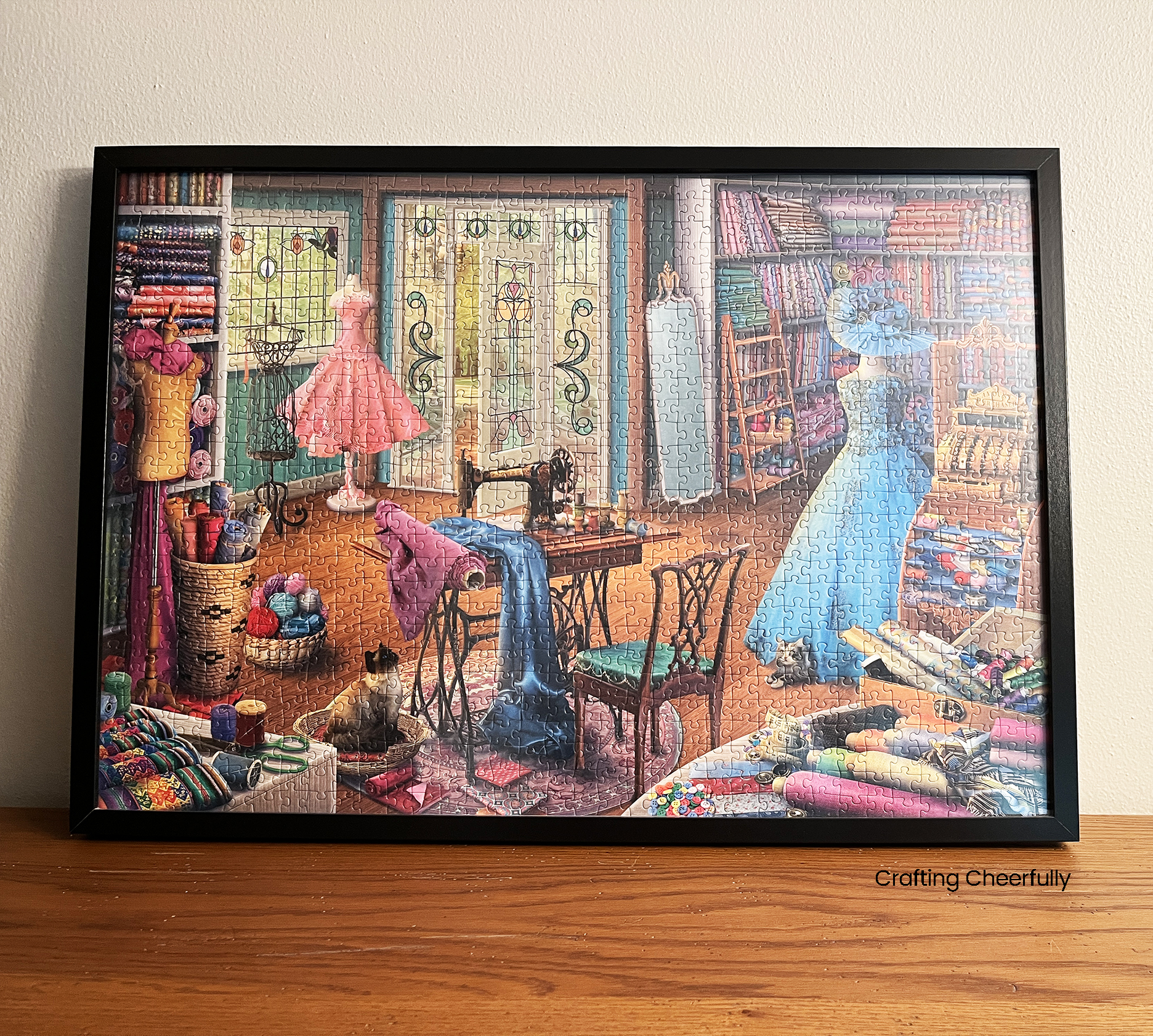 Jigsaw puzzle framed for craft and sewing room.