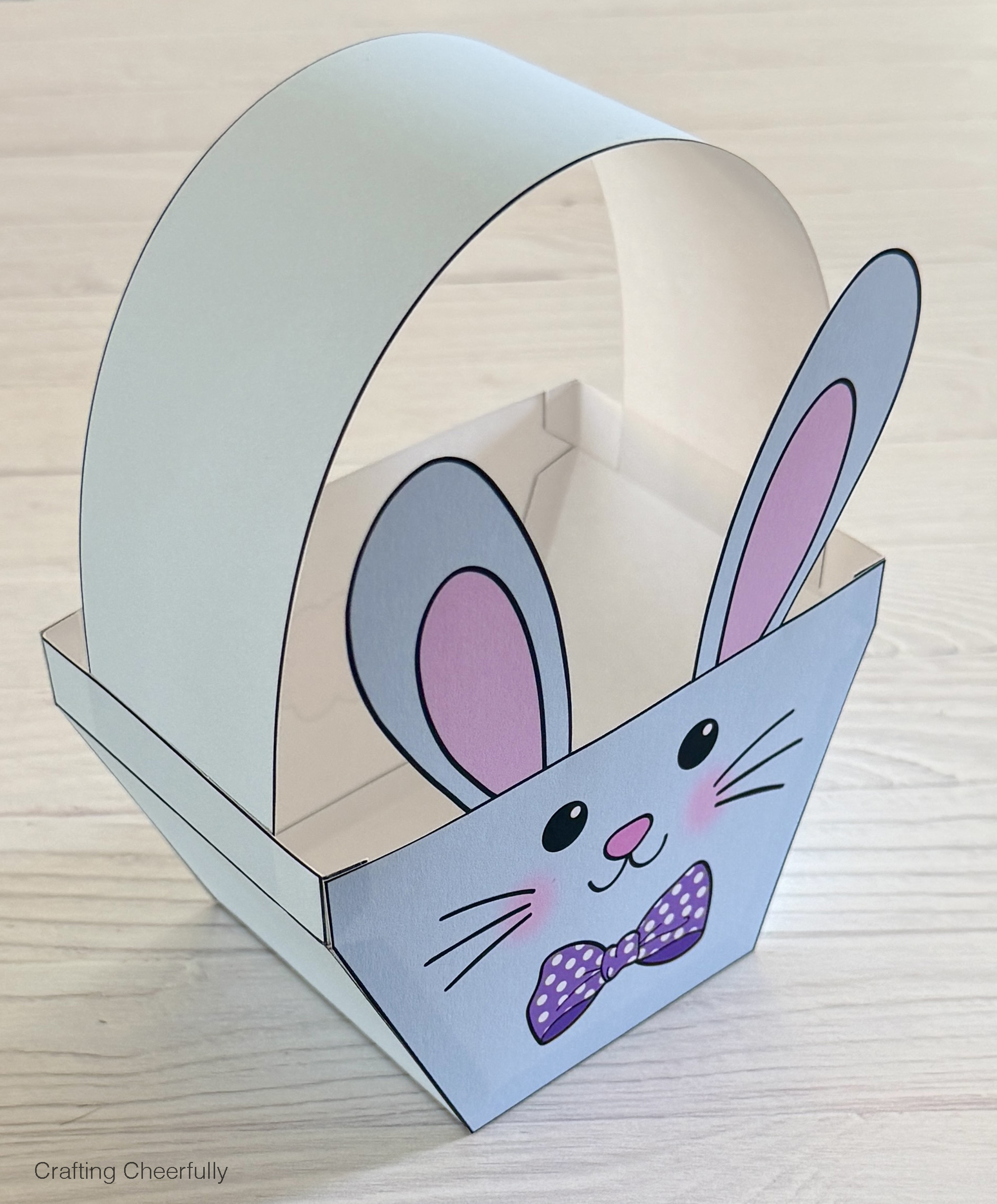 Both ends of the paper handle are attached to the box.