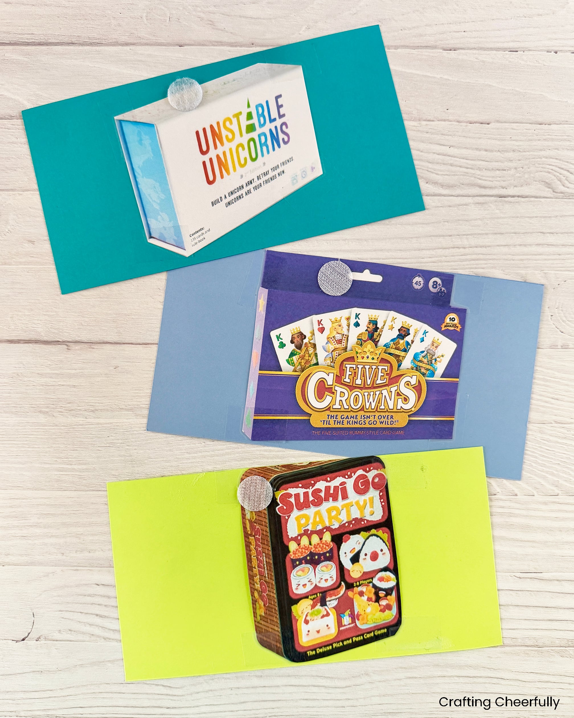 Three clue cards with sticki dots on the back along with a printed picture of the game.