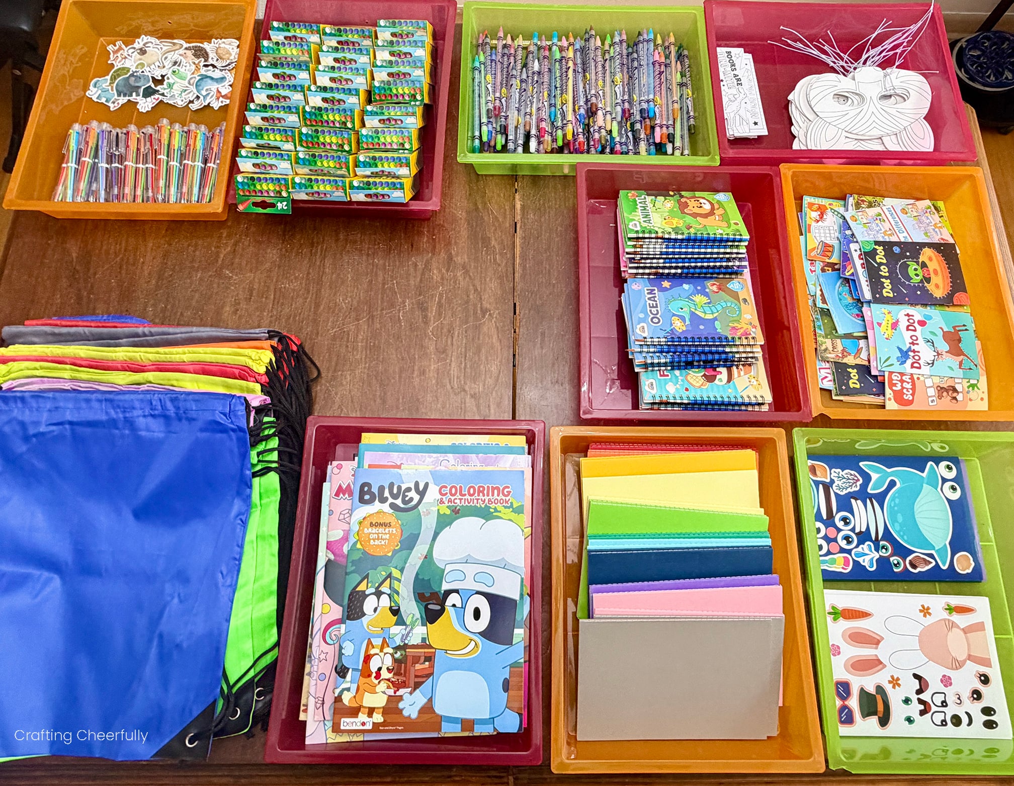 All of the supplies are organized on a table in separate trays.