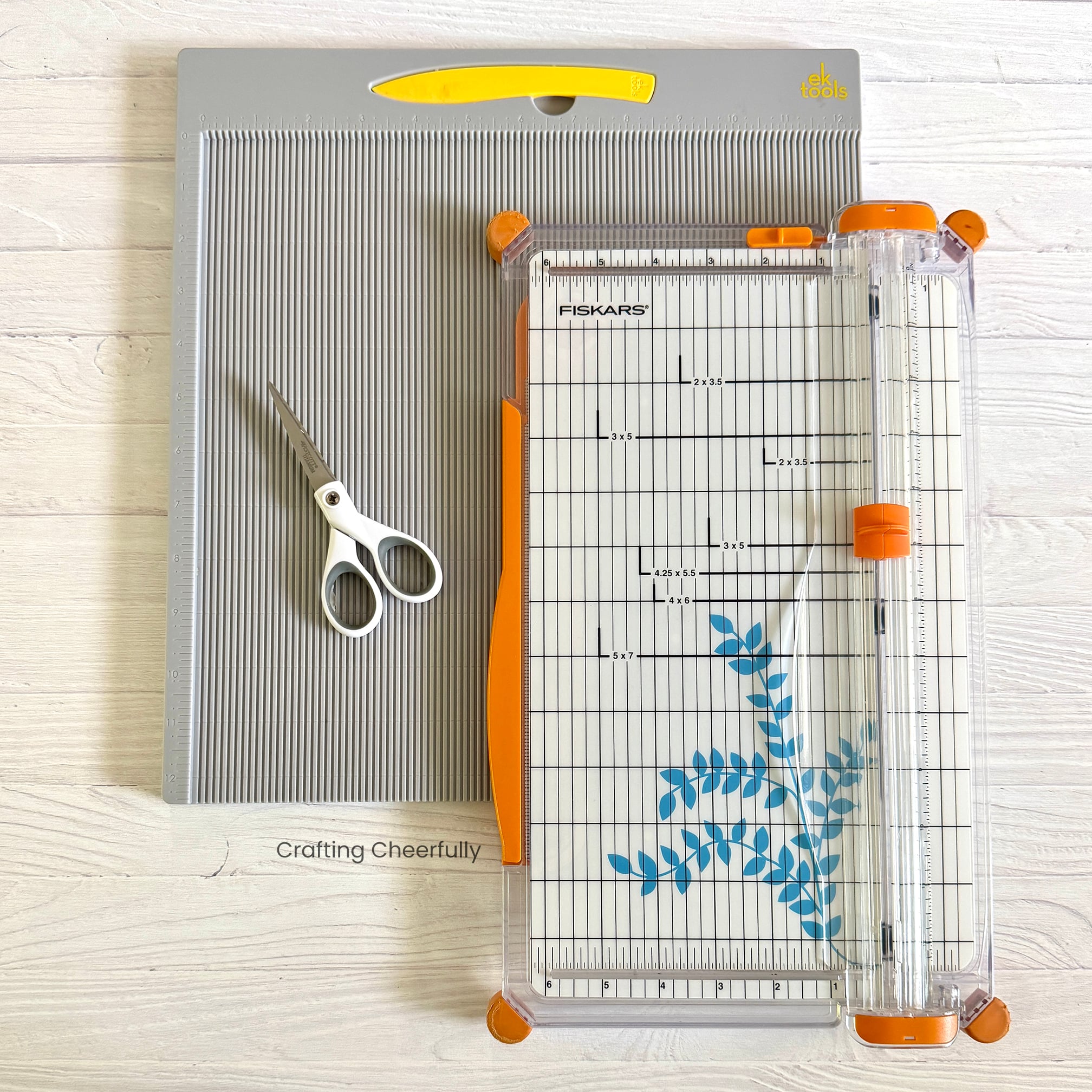 Scoring board, paper trimmer and scissors.