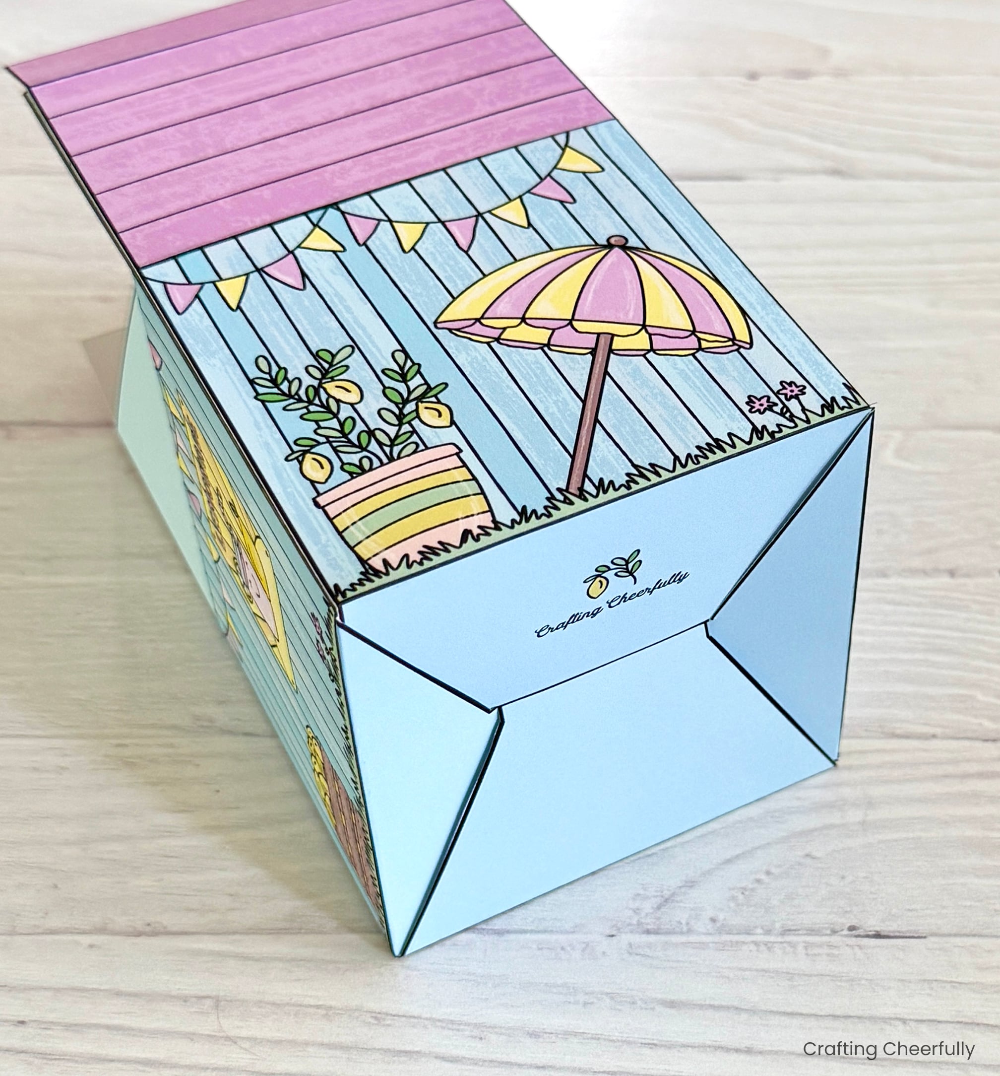 The bottom of the treat box is assembled and folded together.