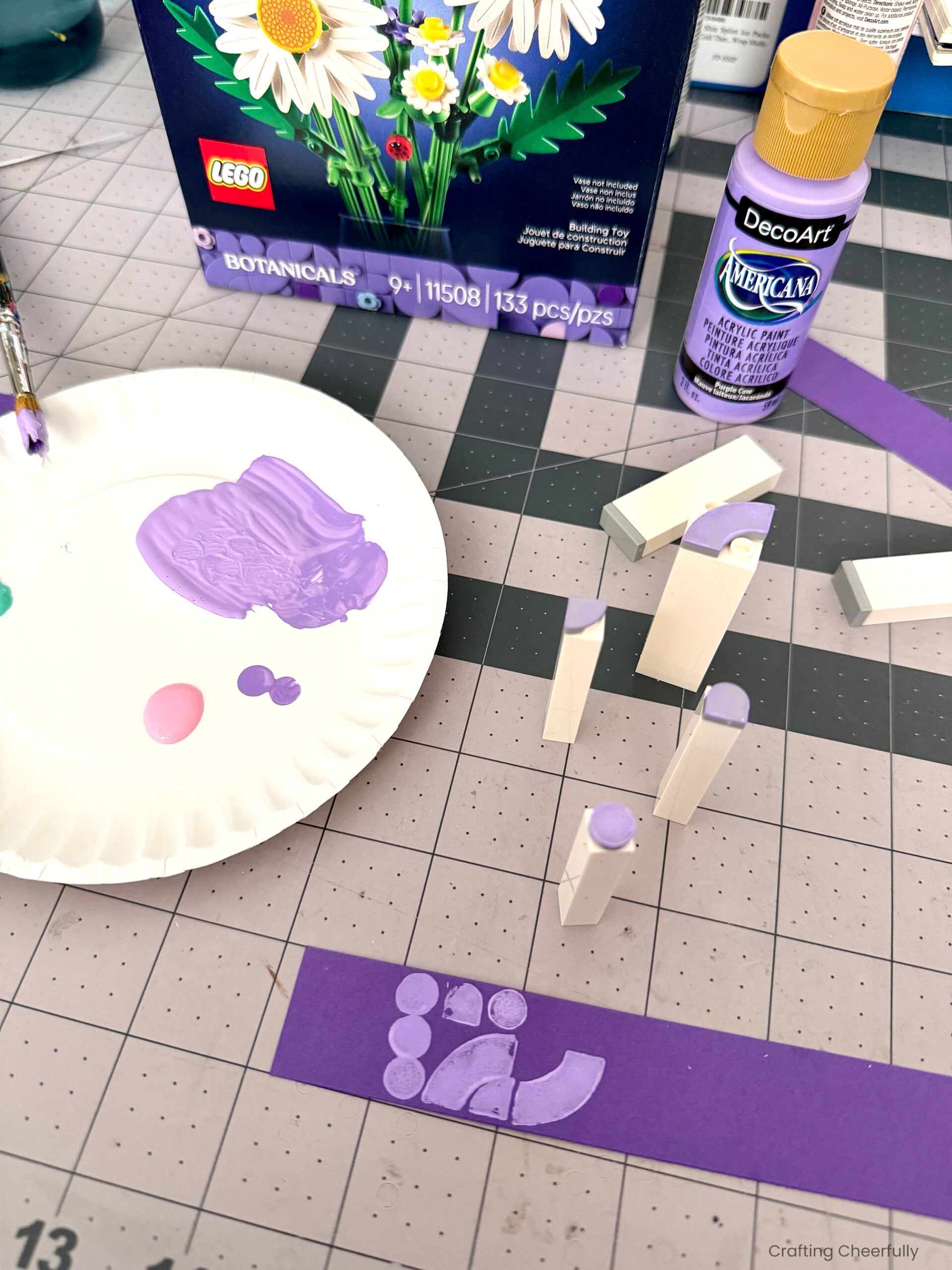 The LEGO print shapes on the purple strip of paper.