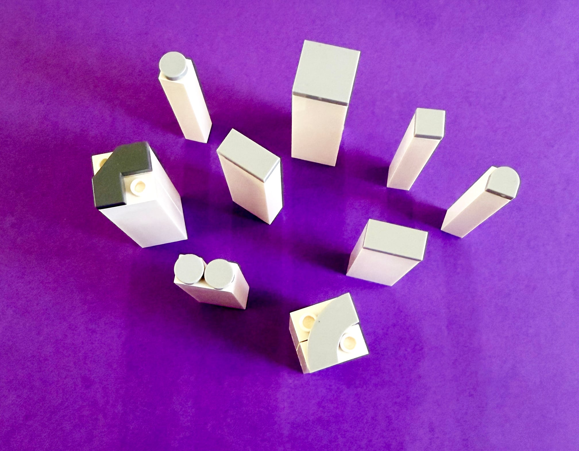 Stamps made from LEGO with different small plates on top.