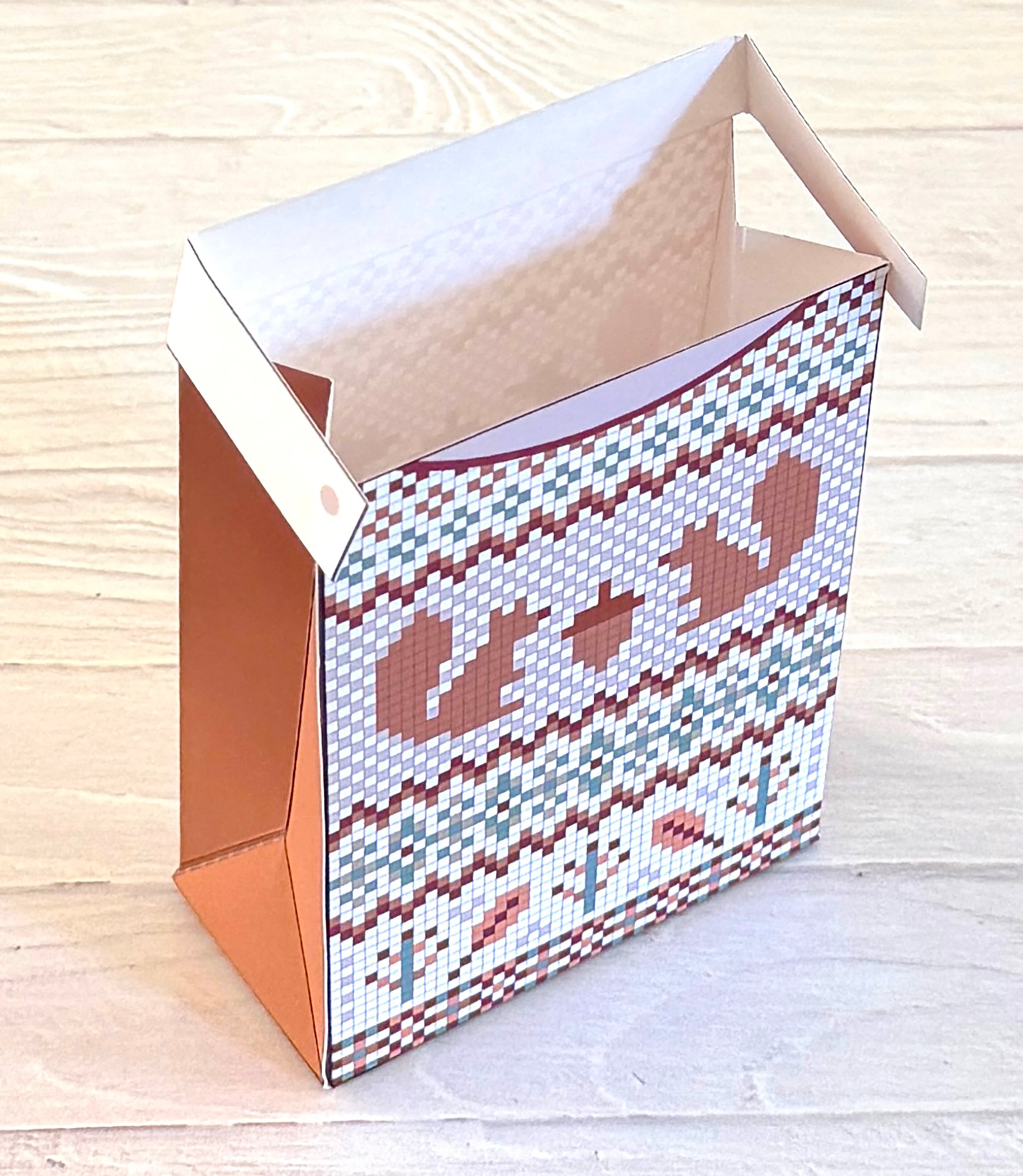 Squirrel sweater treat box is open at the top.
